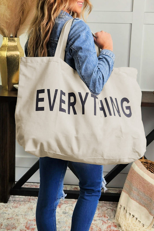 Carry all your essentials in style with our white EVERYTHING letter print large canvas tote bag. This spacious and durable bag is perfect for shopping, work, or travel. The eye-catching print adds a trendy touch. Shop now at IOPCCLOTHING.